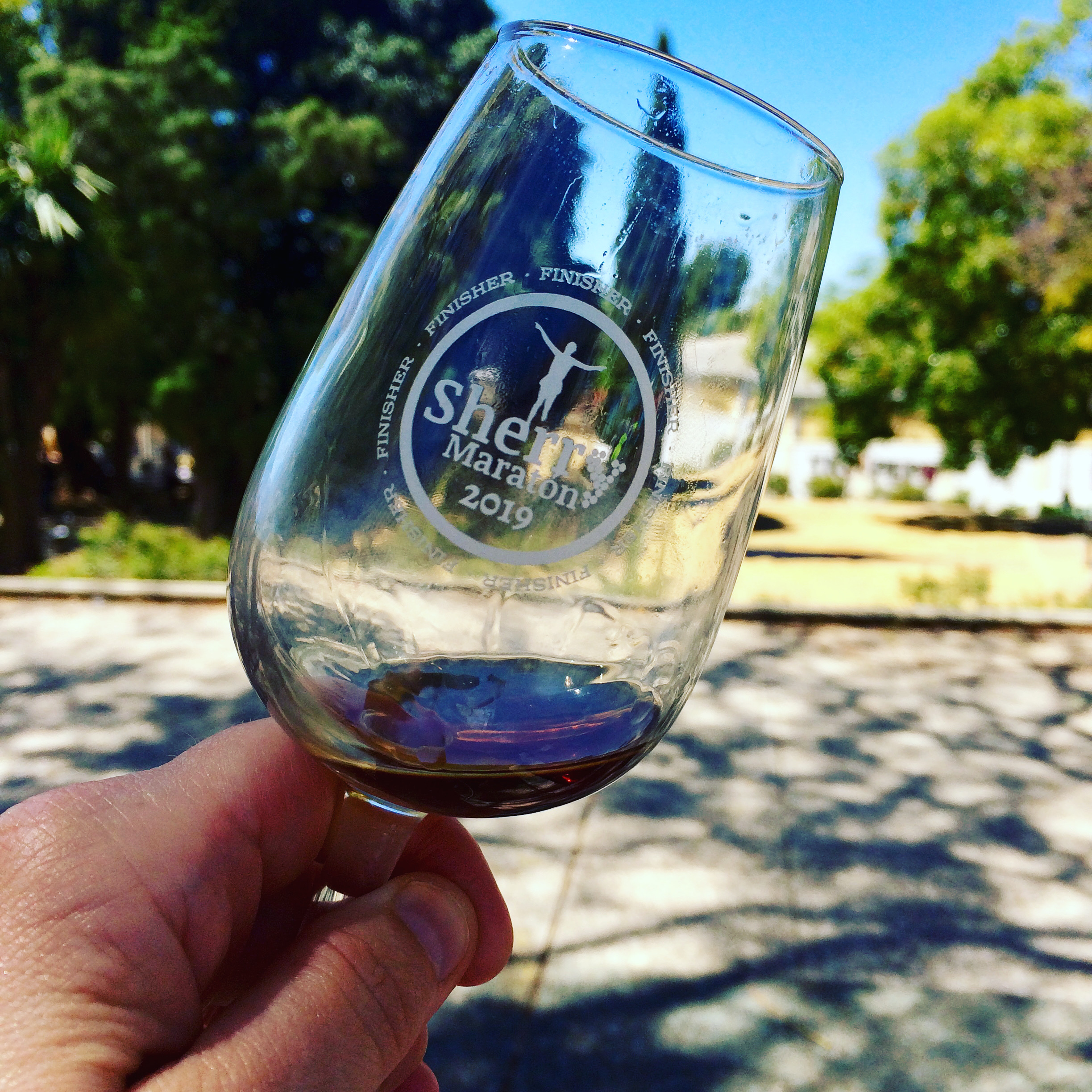 Glass of sherry awarded to all finishers of the Sherry Marathon in Jerez de la Frontera, Andalucia, Spain