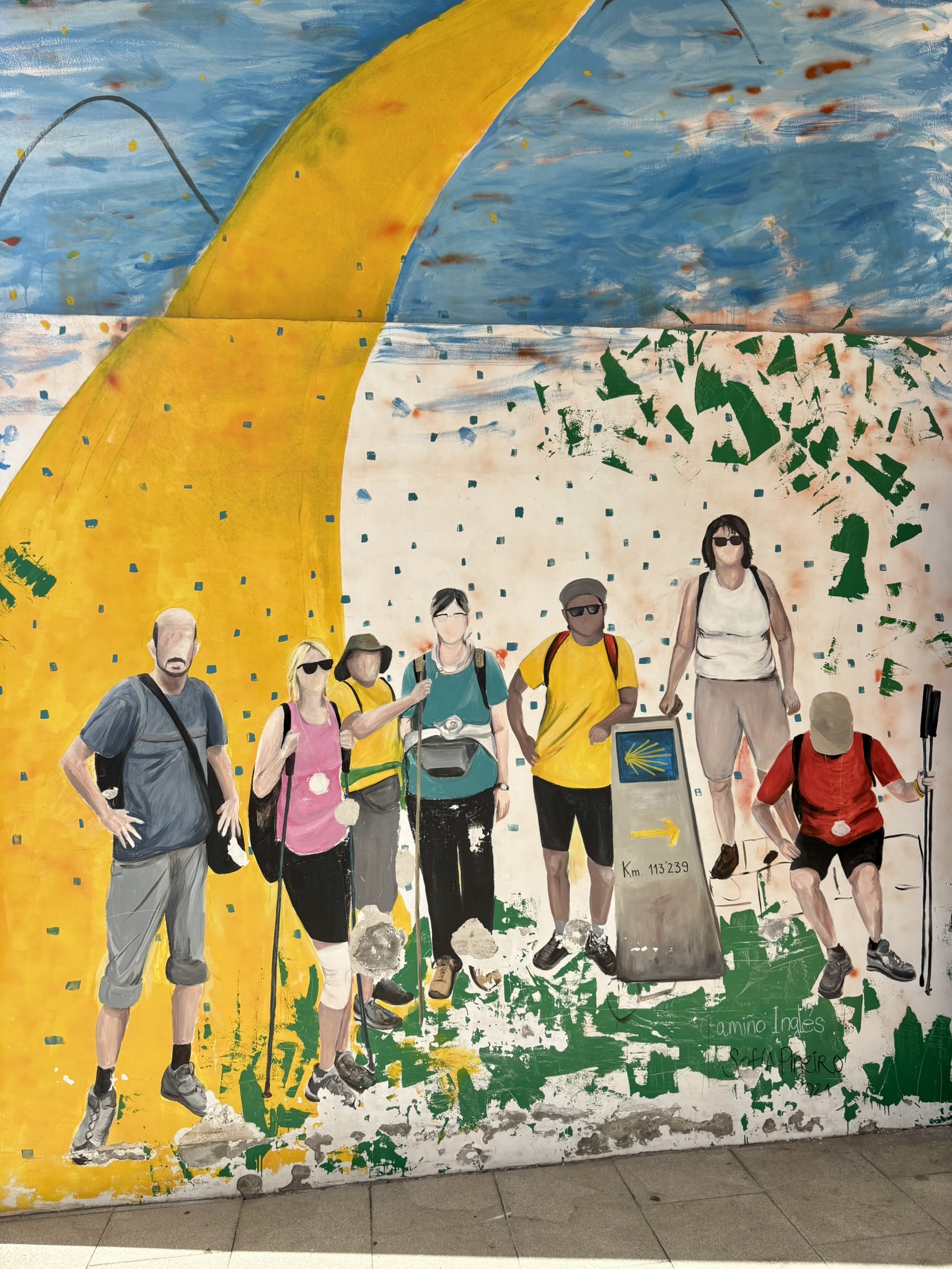 A mural depicting pilgrims on the Camino Inglés